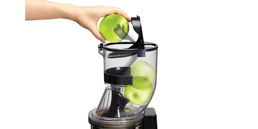 An industrial juicer with a wide opening for different shapes and sizes of fruits and vegetables